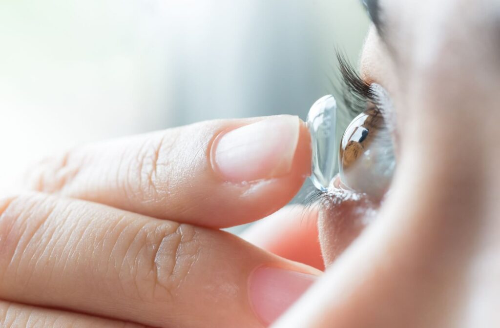 An extreme close-up of a MiSight contact lens being put on on a person's right eye.