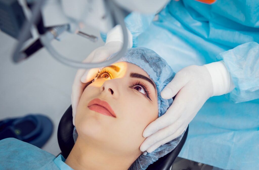 A woman lying on an operation bed ready for a laser eye surgery