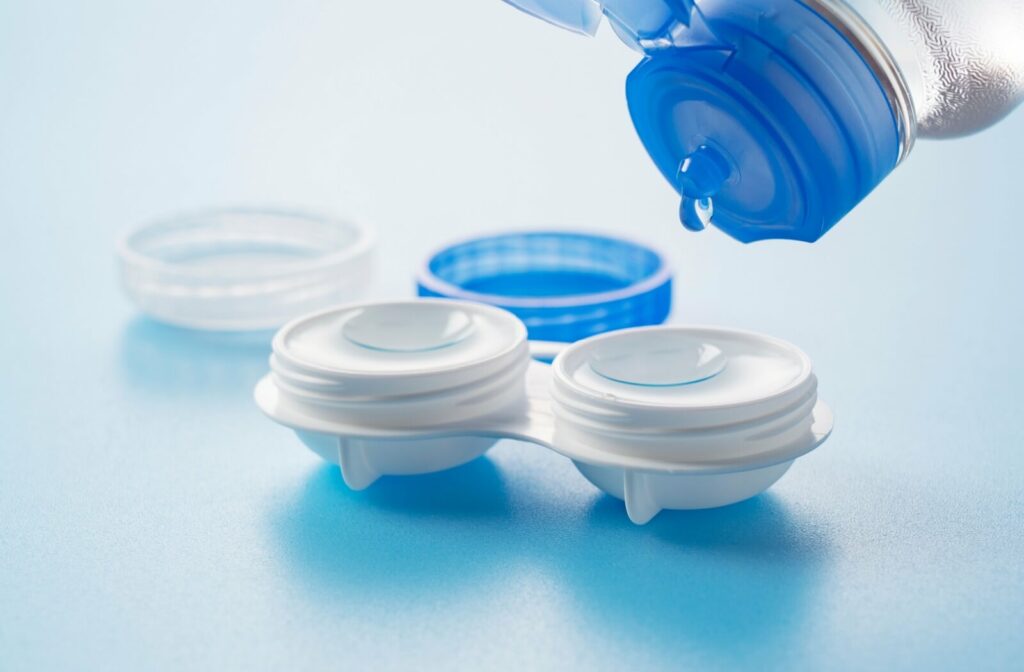 a pair of contact lenses in a contact lens case with saline.